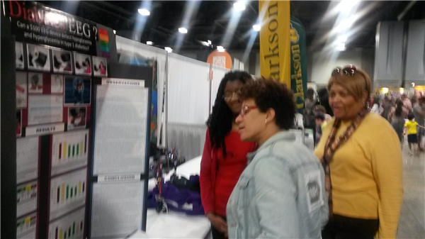 Photo-Carlea presenting her research to Dr. Carla Easter of NIH..jpg