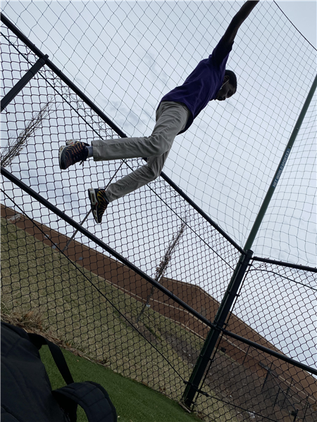 Beyan jumping off fence.jpg